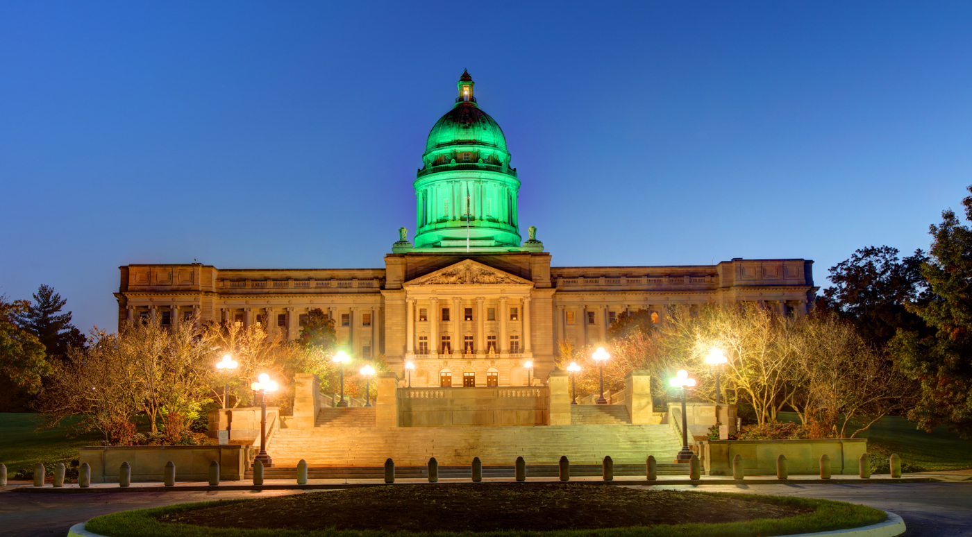 Kentucky Captiol at night with top green